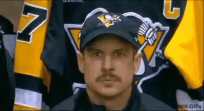 A Man With A Mustache Wearing A Hat And A Jersey With The Number 7 On It GIF