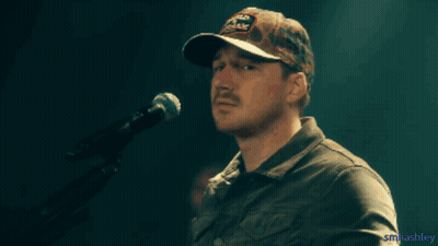 A Man With A Mustache Wearing A Hat That Says Old Dominion GIF
