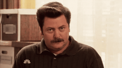 A Man With A Mustache Wearing A Nbc Polo Shirt GIF