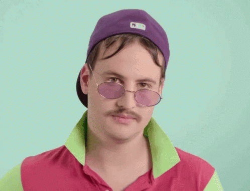 A Man With A Mustache Wearing Sunglasses And A Hat GIF