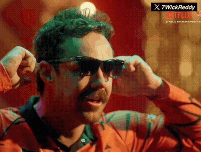 A Man With A Mustache Wearing Sunglasses With A Netflix Logo In The Corner GIF