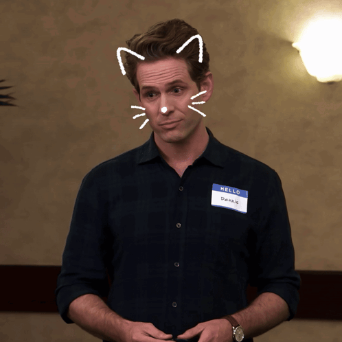 A Man With A Name Tag That Says Hello On It GIF