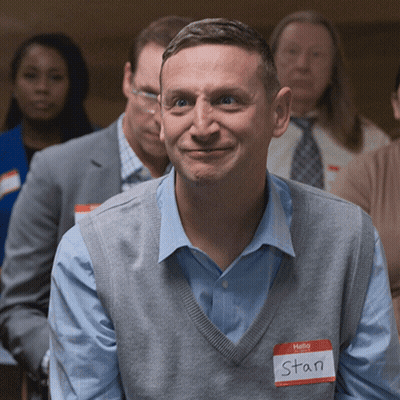 A Man With A Name Tag That Says Hello Stan GIF