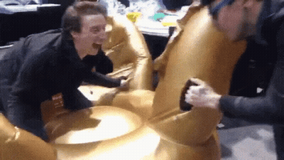 A Man With A Name Tag That Says ' Max ' On It Is Laughing GIF