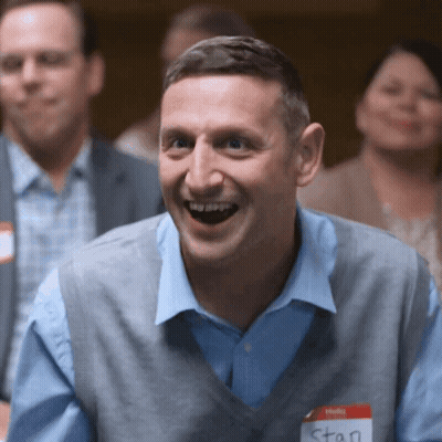 A Man With A Name Tag That Says Stan GIF