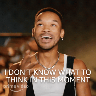 A Man With A Necklace Is Laughing With The Words " I Don 'T Know What To Think In This Moment " Above Him GIF