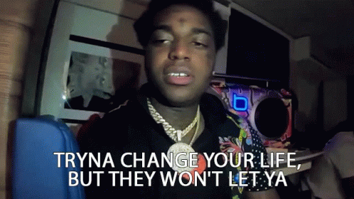A Man With A Necklace On His Neck Says Tryna Change Your Life But They Won 'T Let Ya GIF