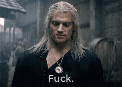 A Man With A Necklace That Has The Word Fuck On It GIF