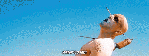A Man With A Needle Sticking Out Of His Neck And The Words `` Witness Me '' . GIF