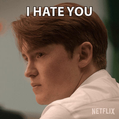 A Man With A Netflix Logo On His Shirt GIF