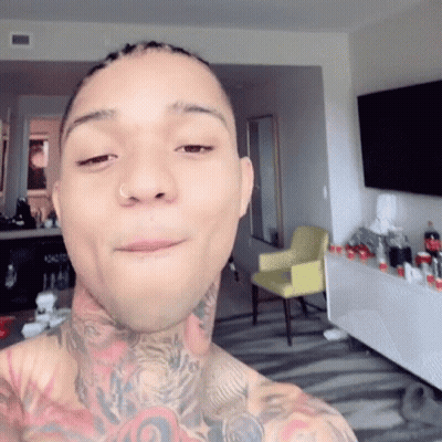 A Man With A Nose Ring Is Taking A Selfie GIF