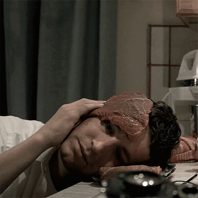 A Man With A Piece Of Meat On His Face GIF