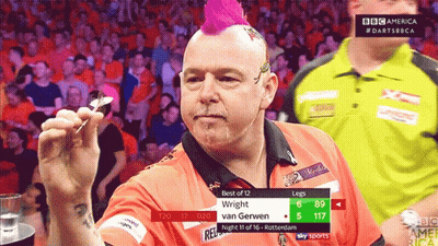 A Man With A Pink Mohawk Is Holding A Dart GIF