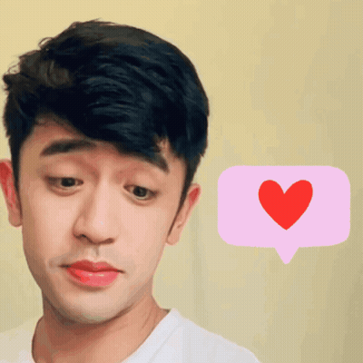 A Man With A Pink Speech Bubble With A Red Heart On It GIF