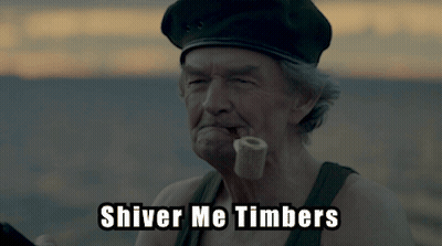 A Man With A Pipe In His Mouth And The Words Shiver Me Timbers Above Him GIF