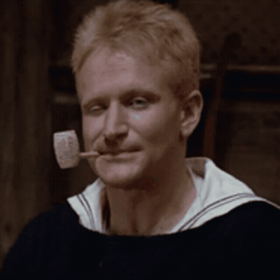 A Man With A Pipe In His Mouth That Says Popeye On It GIF