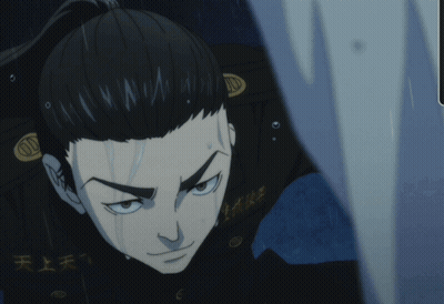 A Man With A Ponytail And Chinese Writing On His Jacket GIF