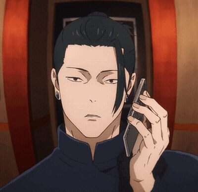 A Man With A Ponytail Is Talking On A Cellphone GIF