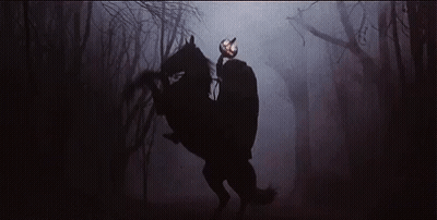 A Man With A Pumpkin Head Is Riding A Horse In The Dark GIF