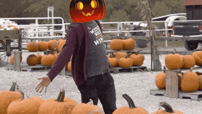 A Man With A Pumpkin On His Head Wearing A Shirt That Says Witches Hate Witches GIF