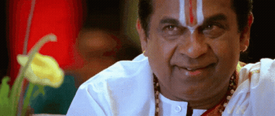 A Man With A Red And White Stripe On His Forehead Smiles For The Camera GIF