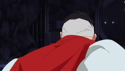 A Man With A Red Cape Covering His Head GIF