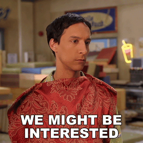 A Man With A Red Cape On His Neck Says We Might Be Interested GIF
