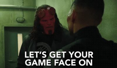 A Man With A Red Face Is Talking To Another Man With The Words Let 'S Get Your Game Face On On The Bottom GIF