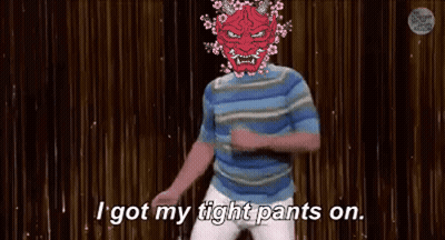 A Man With A Red Mask On His Head Is Dancing On A Stage And Says `` I Got My Tight Pants On '' . GIF