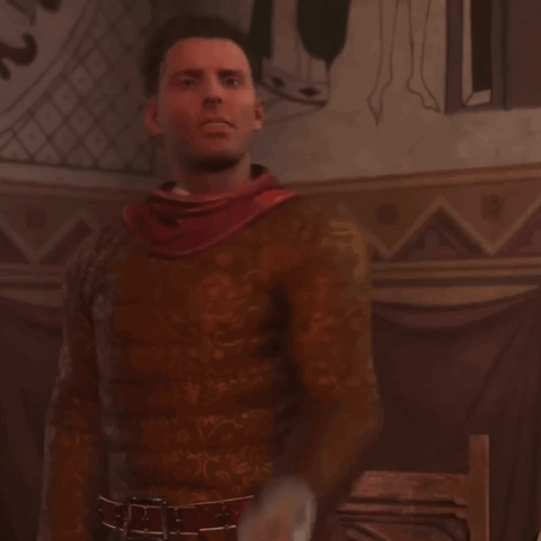 A Man With A Red Scarf Around His Neck Is Standing In Front Of A Wall GIF