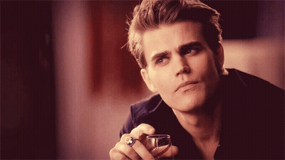 A Man With A Ring On His Finger Holds A Glass GIF