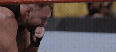A Man With A Ring On His Finger Is Kneeling In A Boxing Ring GIF