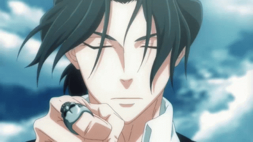 A Man With A Ring On His Finger Is Looking At The Camera GIF