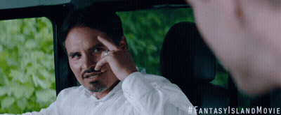 A Man With A Ring On His Finger Is Sitting In A Car With A #Fantasyislandmovie Hashtag GIF