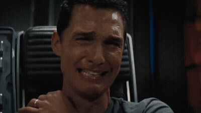 A Man With A Ring On His Finger Is Smiling With His Hand On His Chin GIF