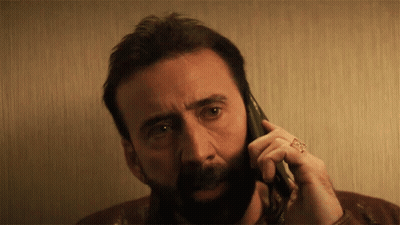 A Man With A Ring On His Finger Is Talking On A Phone GIF