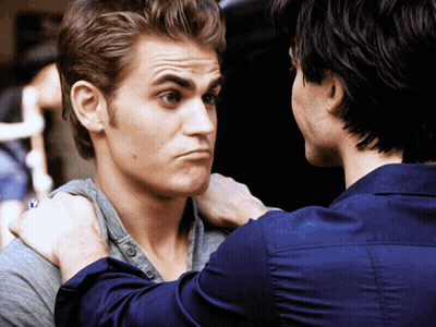 A Man With A Ring On His Finger Looks At Another Man GIF
