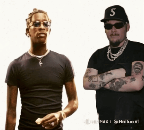 A Man With A S On His Hat Is Standing Next To Another Man GIF