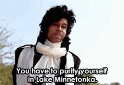 A Man With A Scarf Around His Neck Is Saying You Have To Purify Yourself In Lake Minnetonka GIF