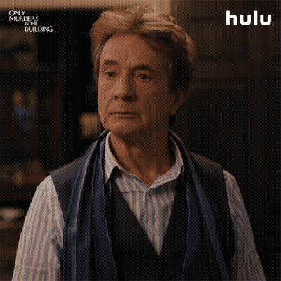 A Man With A Scarf Around His Neck Says The Word True GIF