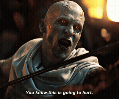 A Man With A Scarf Around His Neck Says You Know This Is Going To Hurt GIF