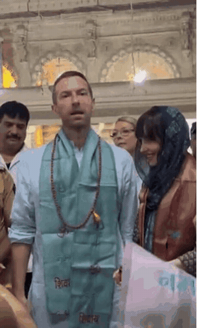 A Man With A Scarf Around His Neck That Says Shiva On It GIF