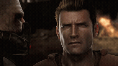 A Man With A Serious Look On His Face Looks At Another Man GIF