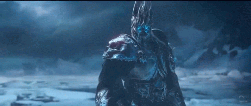 A Man With A Skull On His Head Is Standing In The Snow GIF