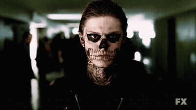 A Man With A Skull Painted On His Face Is Standing In A Dark Hallway With The Fx Logo In The Background GIF