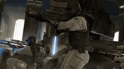 A Man With A Sniper Rifle Has The Letter E On His Chest GIF