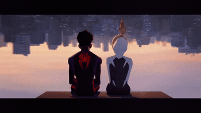 A Man With A Spider On His Back Sits Next To A Girl GIF