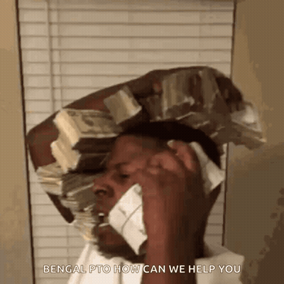 A Man With A Stack Of Money On His Head Is Talking On A Cell Phone GIF