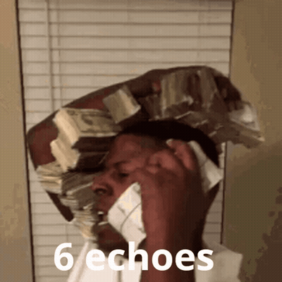 A Man With A Stack Of Money On His Head Talking On A Phone GIF
