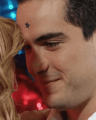 A Man With A Star On His Forehead Is Smiling GIF